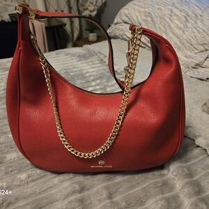 Red with gold details hand bag.
